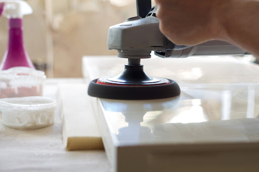 Artisan polishing stone surface